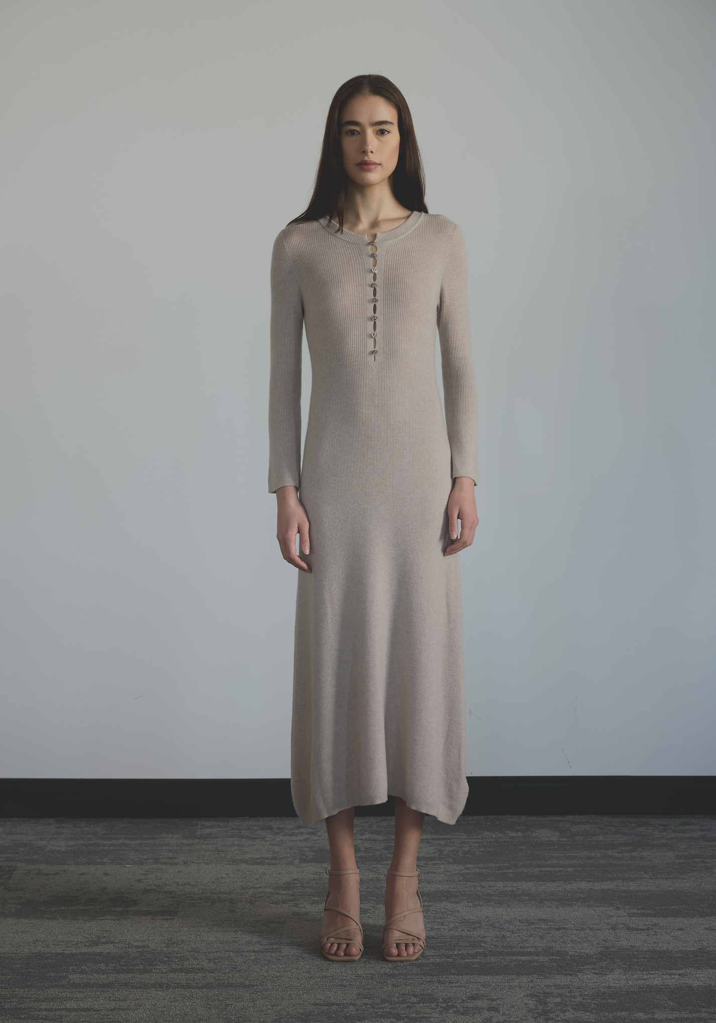 Elegant women’s rib knit cashmere dress with buttoned neckline and close fit