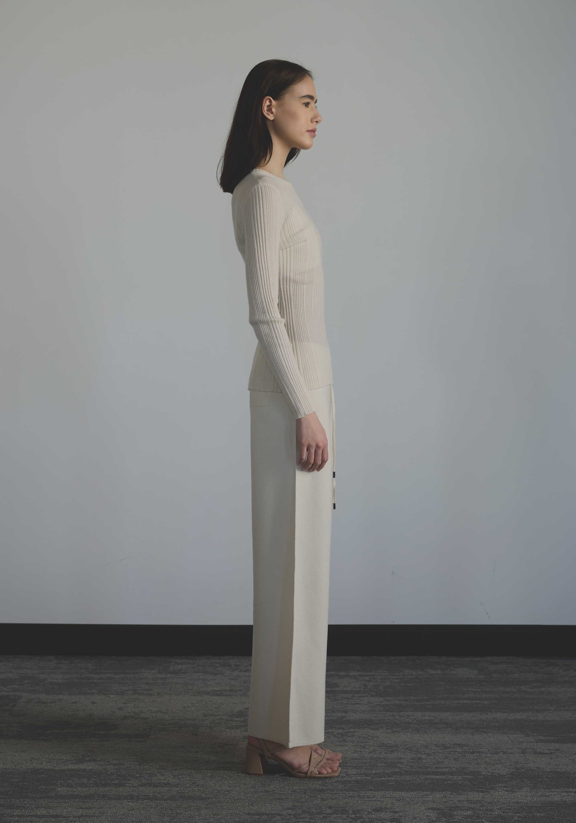 Side view of women’s slim fit cashmere sheer top