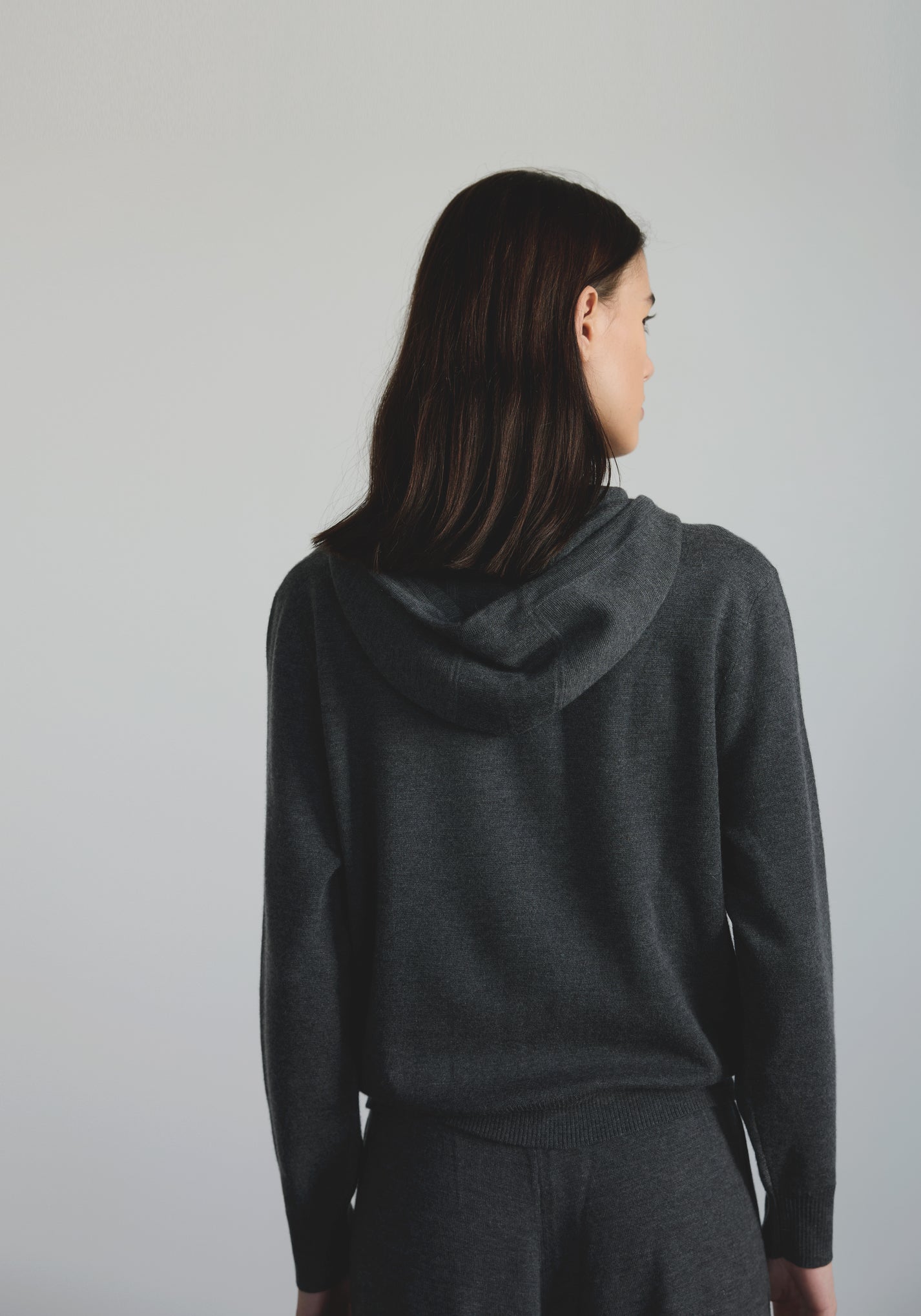 Back view of women’s cashmere lounge hoodie with minimal hood