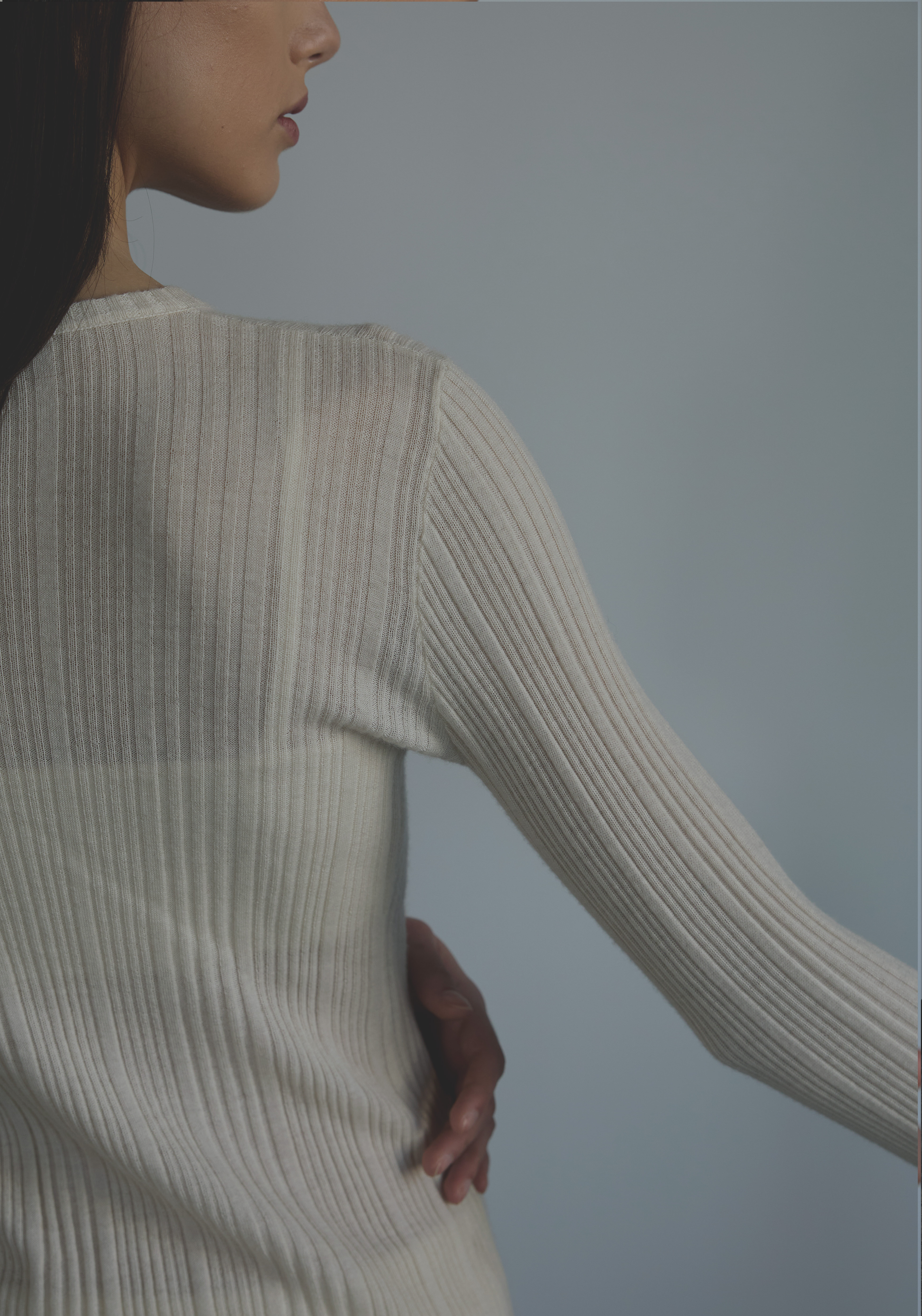 Fine rib knit texture with subtle sheerness on women’s cashmere top