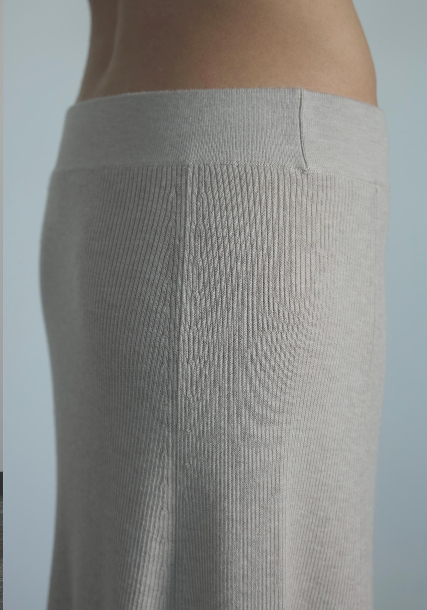 Soft elastic waistband detail on women’s cashmere midi skirt